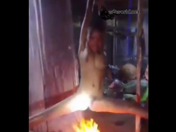 Shocking Video Shows Naked Woman Suspended Over Fire in Benin