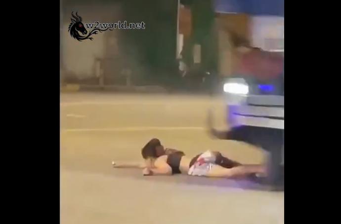 The horrific moment a woman was run over by a truck